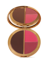 Makeup compact with brown, pink, and red shades on a white background