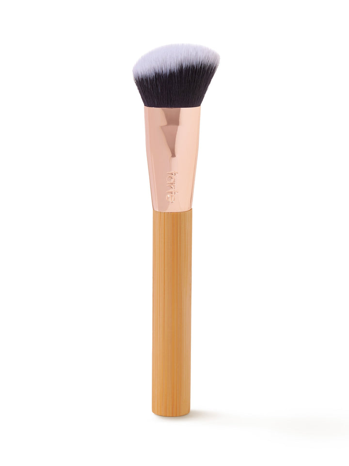 Makeup brush with wooden handle on a white background