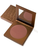 Bronze compact powder in an open case on a white background