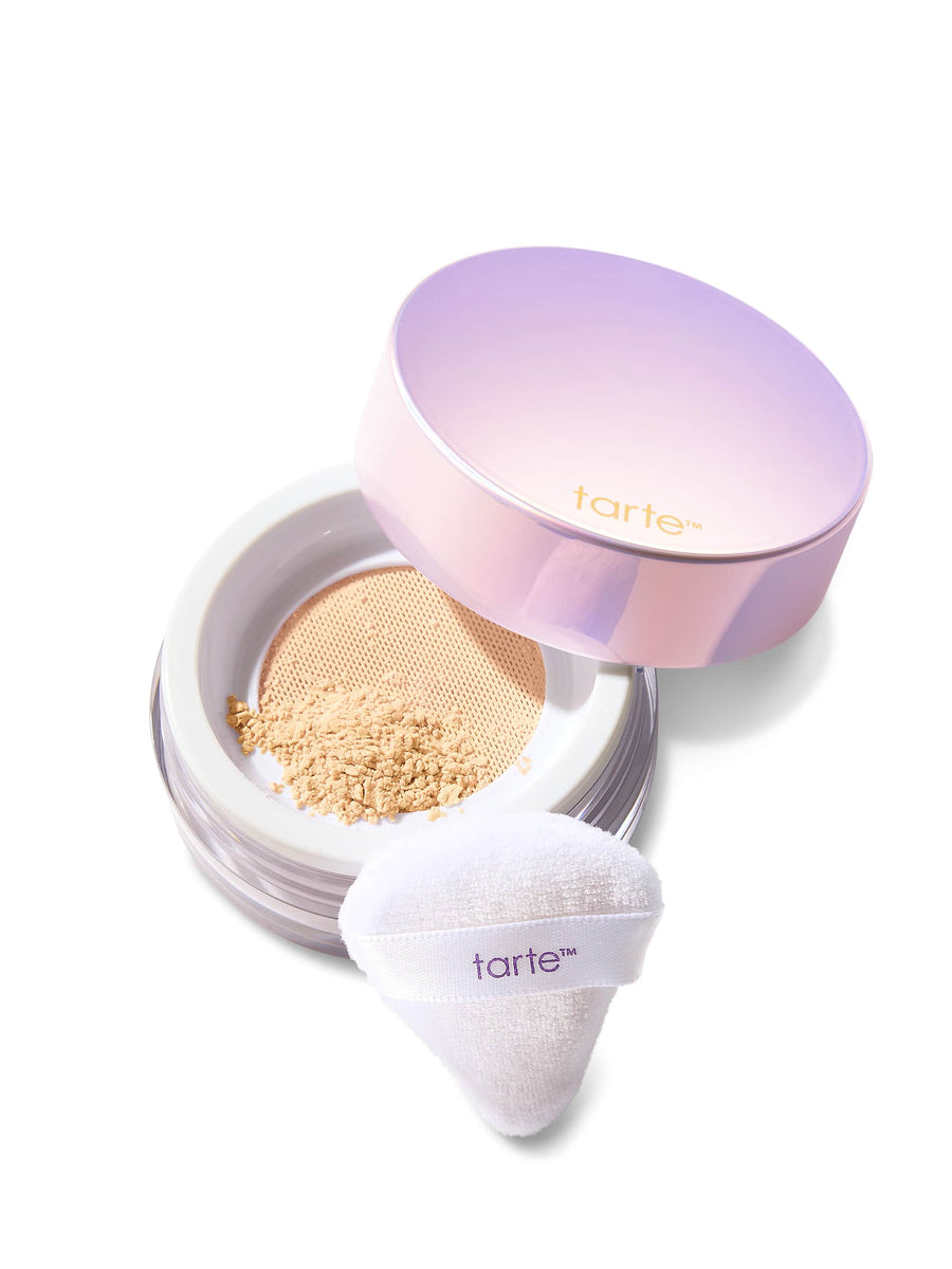 Tarte cosmetic compact with powder and applicator on a white background