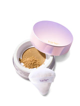 Tarte cosmetic compact with powder and white applicator on a white background