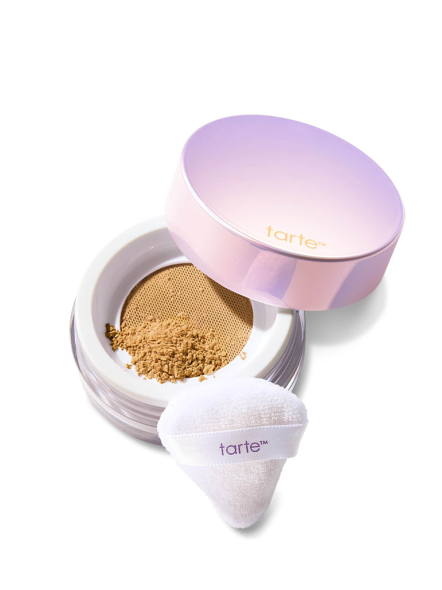 Tarte cosmetic compact with powder and white applicator on a white background