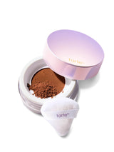 Tarte cosmetic compact with powder and white applicator on a white background