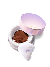 Tarte cosmetic compact with powder and white applicator on a white background