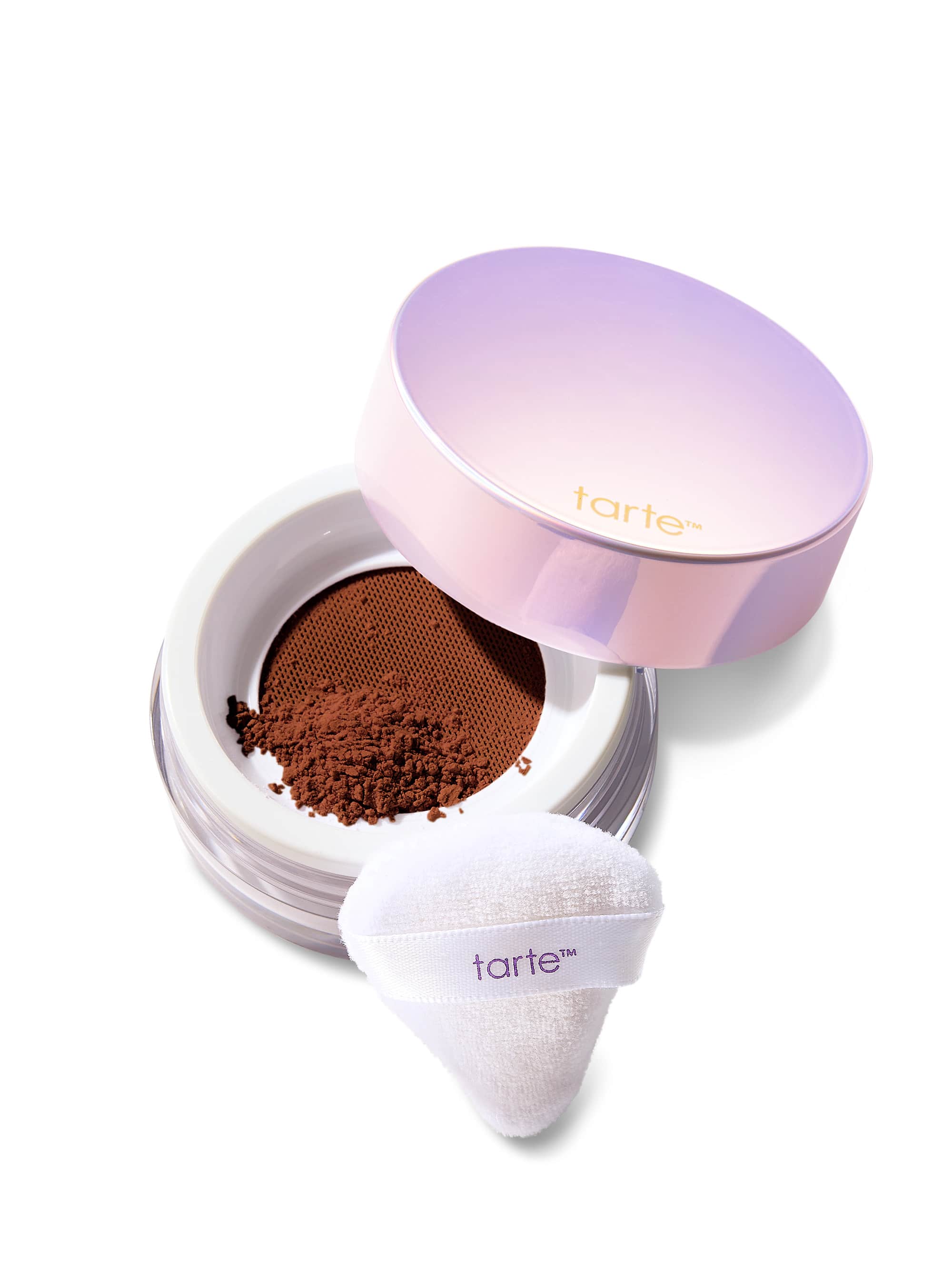 Tarte cosmetic compact with powder and white applicator on a white background