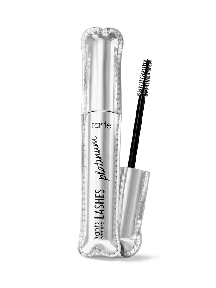 A tube of tarte lights, camera, lashes platinum mascara with the wand applicator shown outside the tube.
