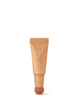 Tube of L'Oréal Skin Genie Glow Care on a white background