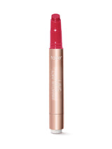 Lip tint with pink cap and rose gold body on a white background
