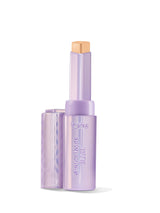 Purple makeup stick with a gold cap on a white background