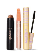 Set of tarte makeup products including maneater silk stick bronzer, maracuja juicy lip plump, and tartelette tubing XL mascara