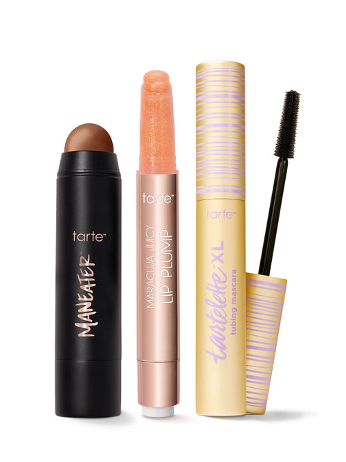 Set of tarte makeup products including maneater silk stick bronzer, maracuja juicy lip plump, and tartelette tubing XL mascara