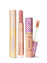 Collection of Tarte lip products including a tartelette tubing XL mascara, maracuja juicy lip plump, and tarte shape tape concealer. 