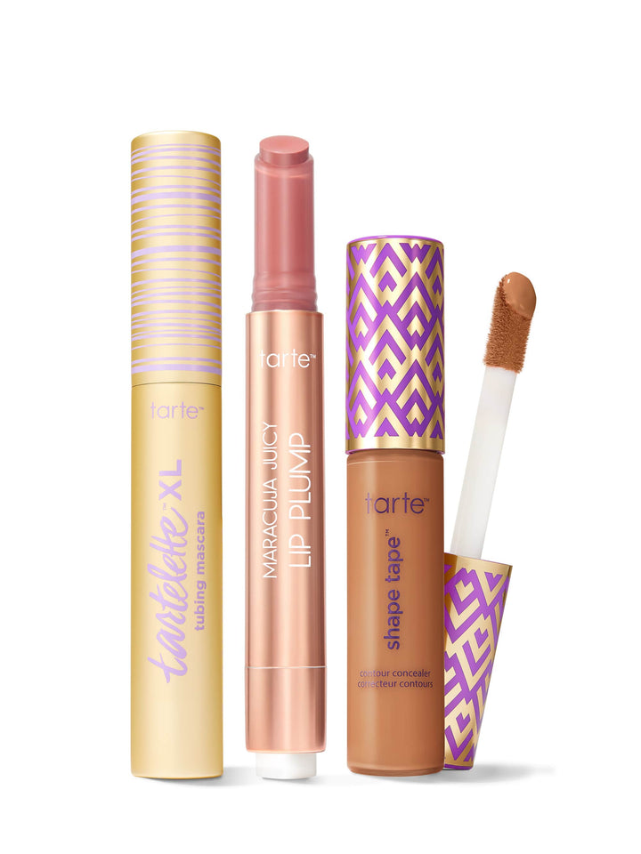 Collection of Tarte lip products including a tartelette tubing XL mascara, maracuja juicy lip plump, and tarte shape tape concealer. 