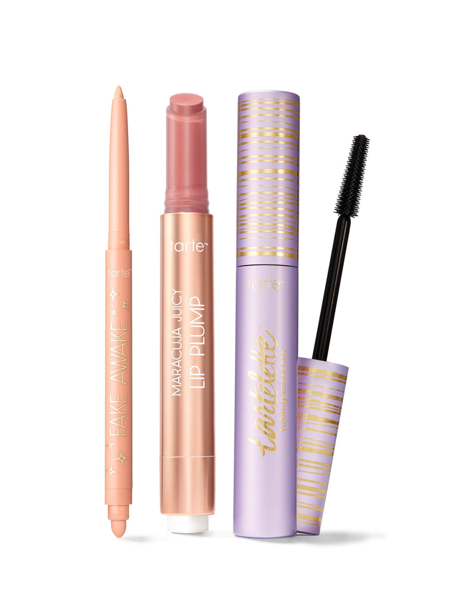 Set of makeup products including a tarte fake awake eye highlight, maracuja juicy lip plump, and tartelette tubing mascara. 