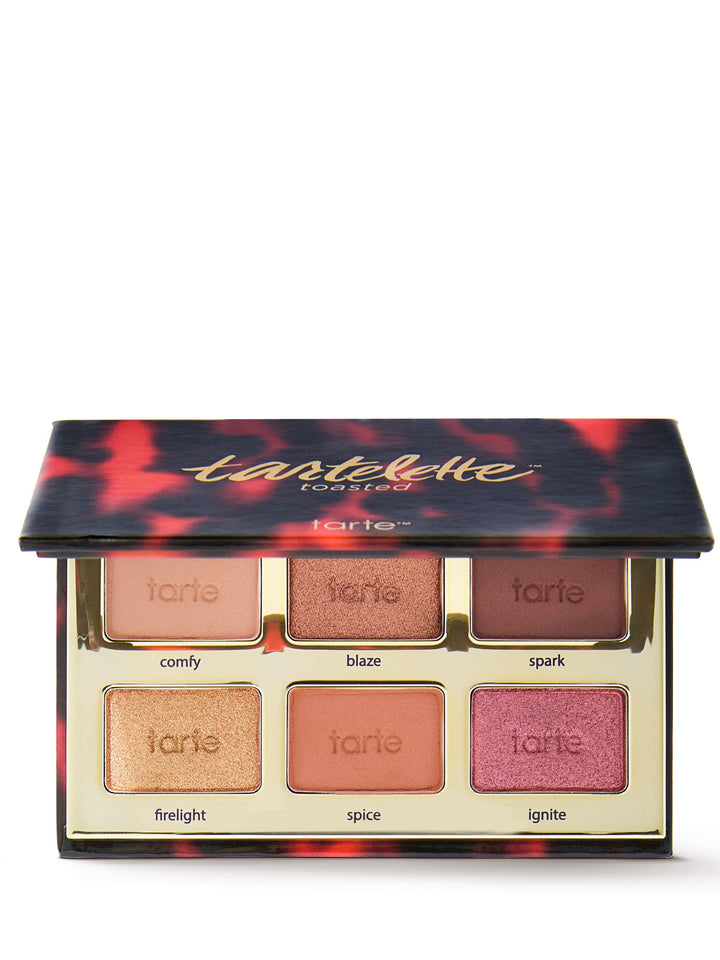 Tartelette toasted makeup palette with open lid showing eyeshadows on a white background