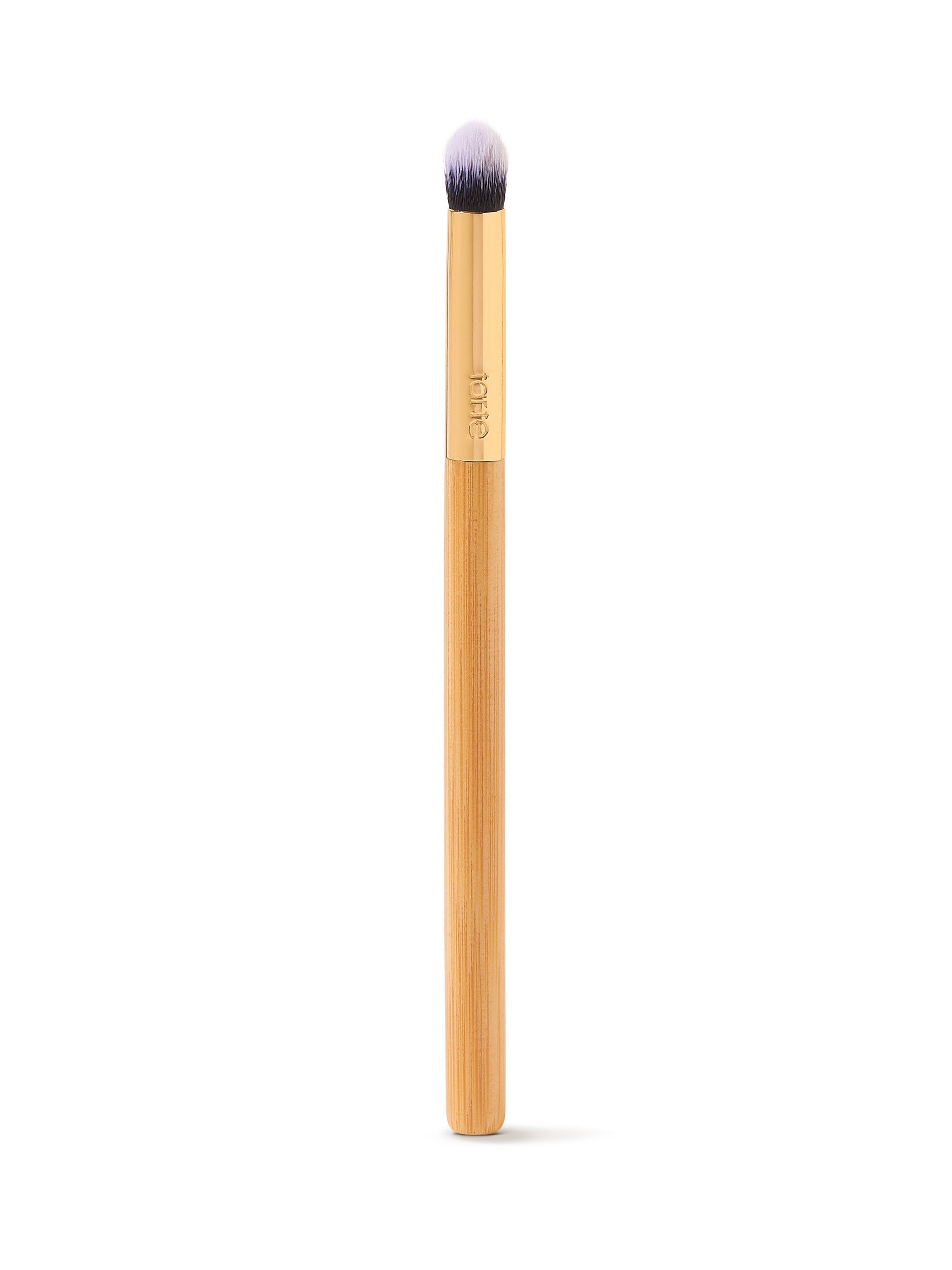 Makeup brush with a wooden handle on a white background
