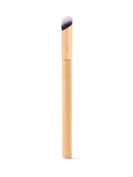 Makeup brush with wooden handle and black bristle head on a white background