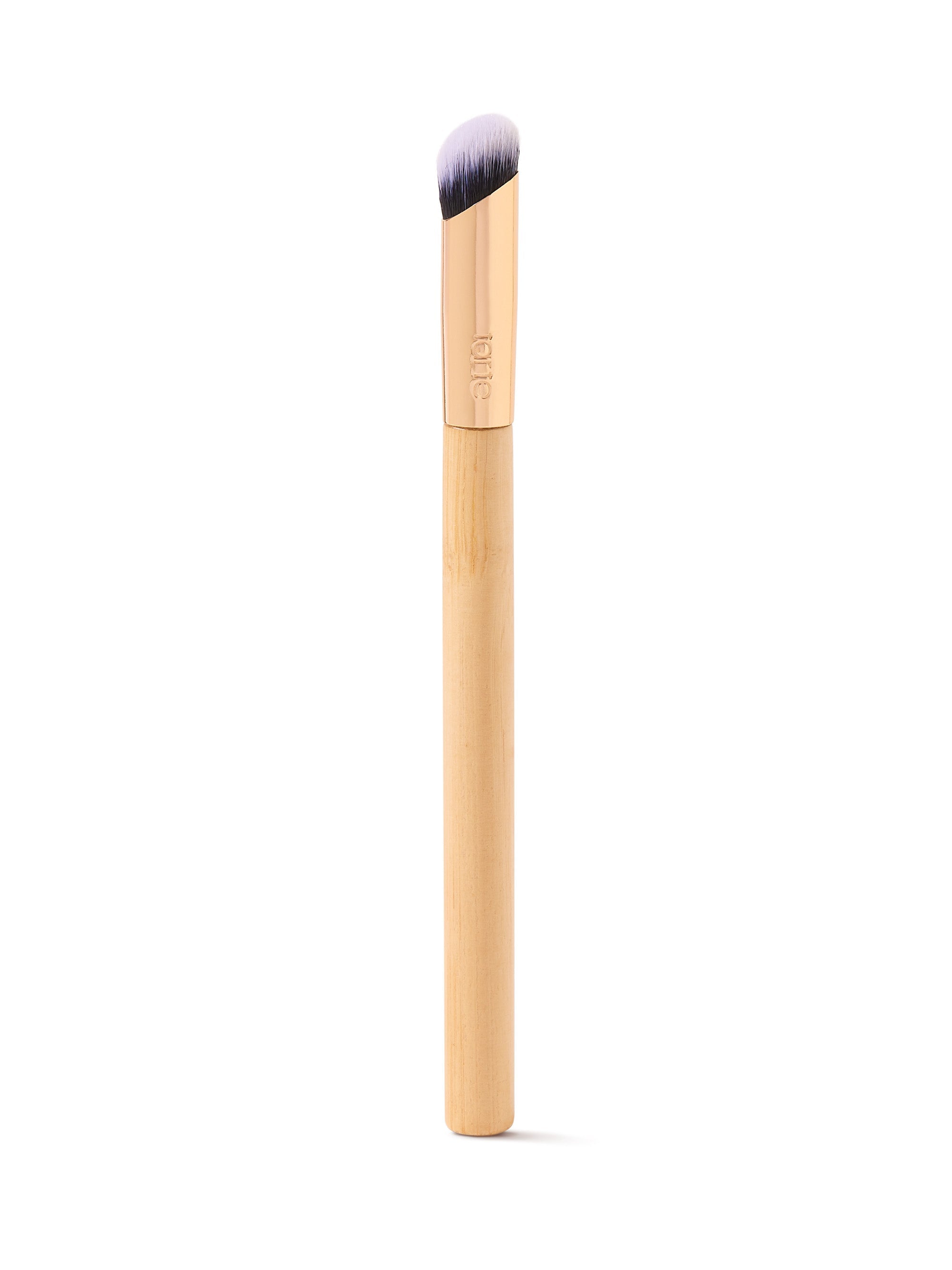 Makeup brush with wooden handle and black bristle head on a white background