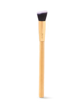 Makeup brush with wooden handle and black bristles on a white background