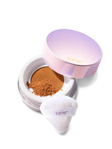 Tarte cosmetic compact with powder and applicator on a white background