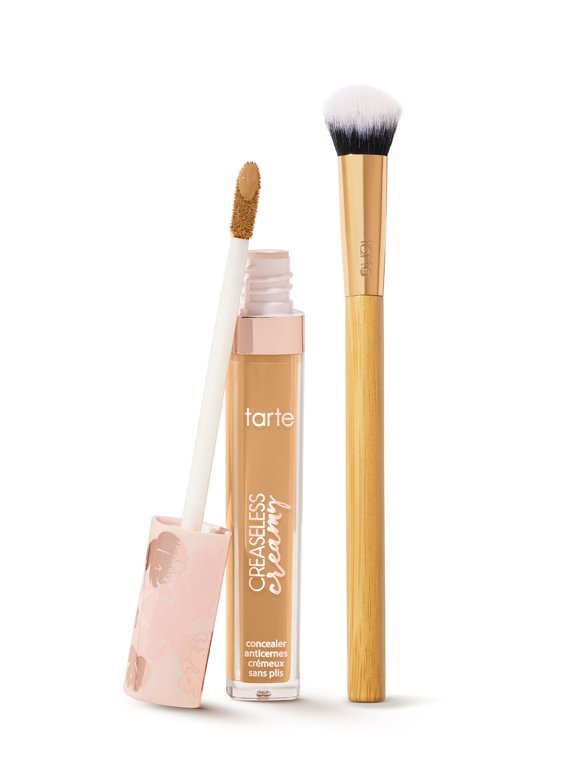  tarte creaseless creamy concealer  with applicator and brush on a white background