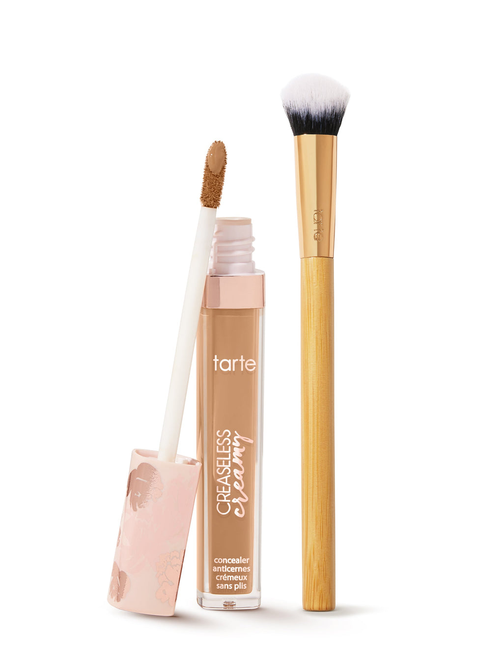  tarte creaseless creamy concealer  with applicator and brush on a white background