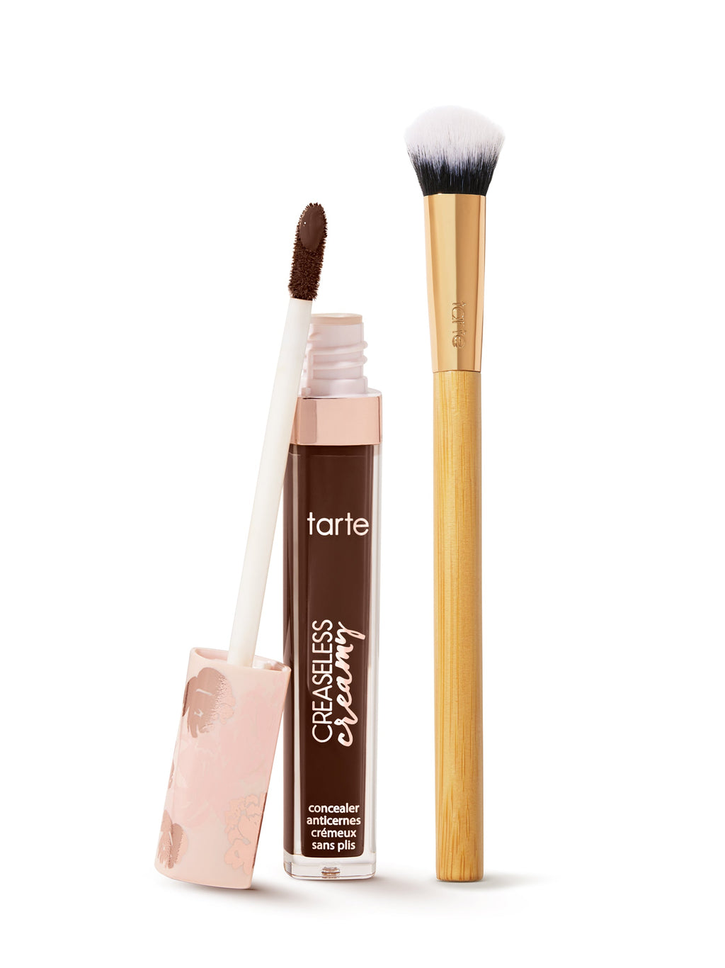 tarte creaseless creamy concealer with applicator and brush on a white background