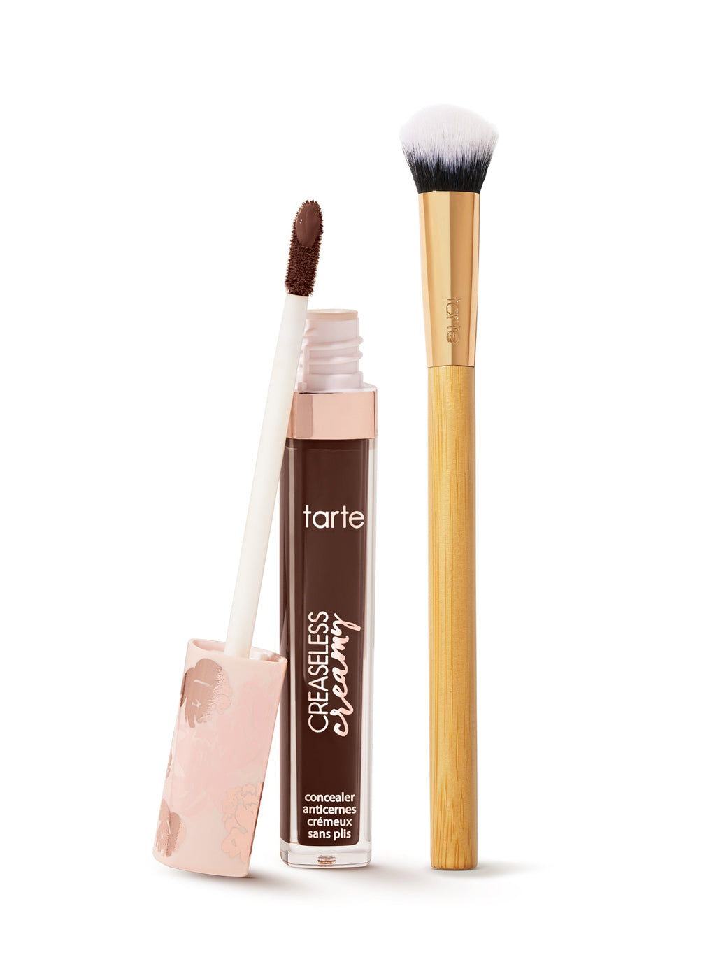  tarte creaseless creamy concealer  with applicator and brush on a white background