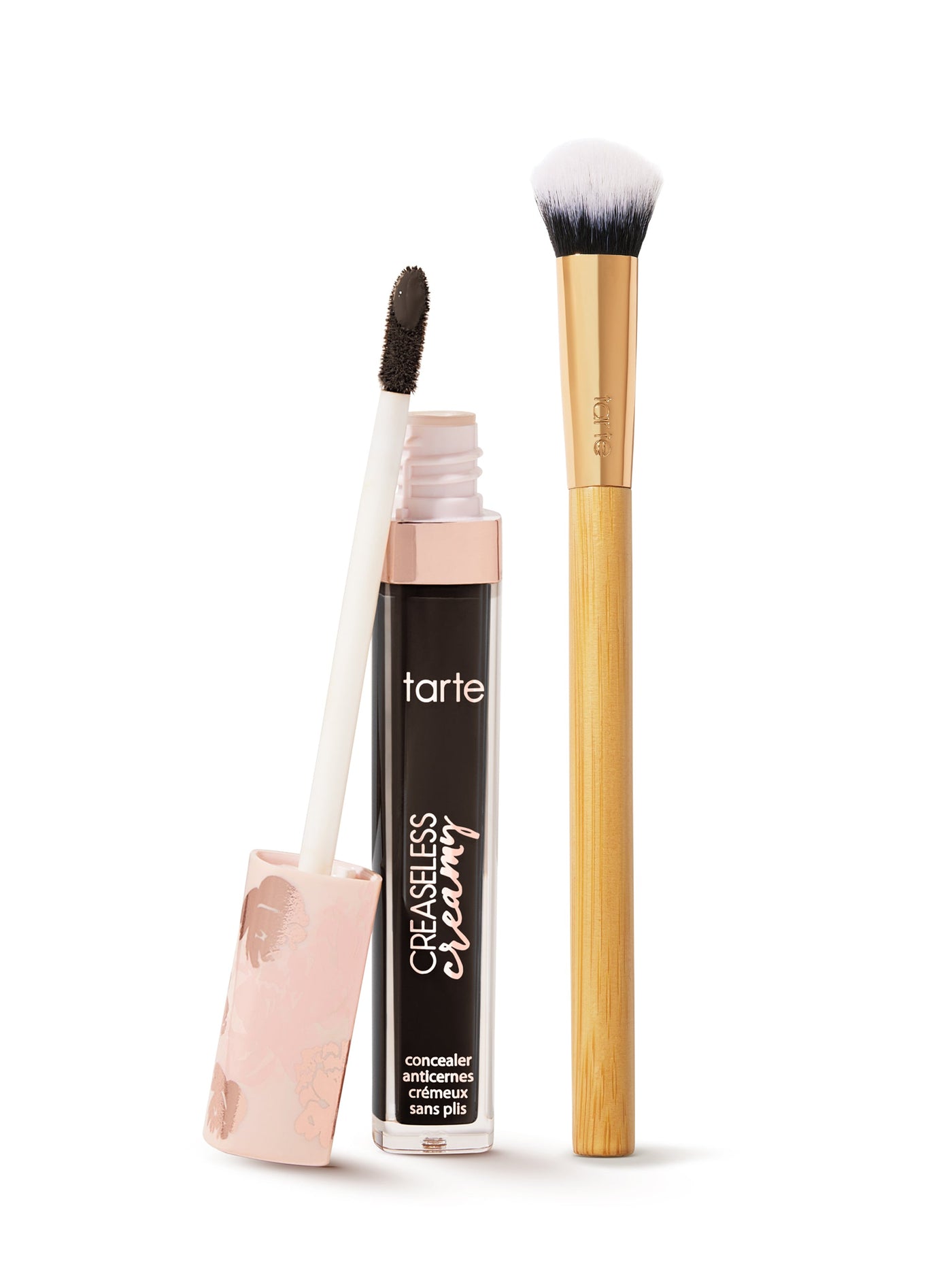  tarte creaseless creamy concealer  with applicator and brush on a white background