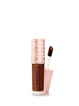 Tarte Shape Tape concealer with applicator on a white background
