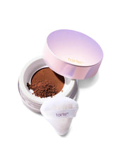 Tarte cosmetic compact with powder and white applicator on a white background