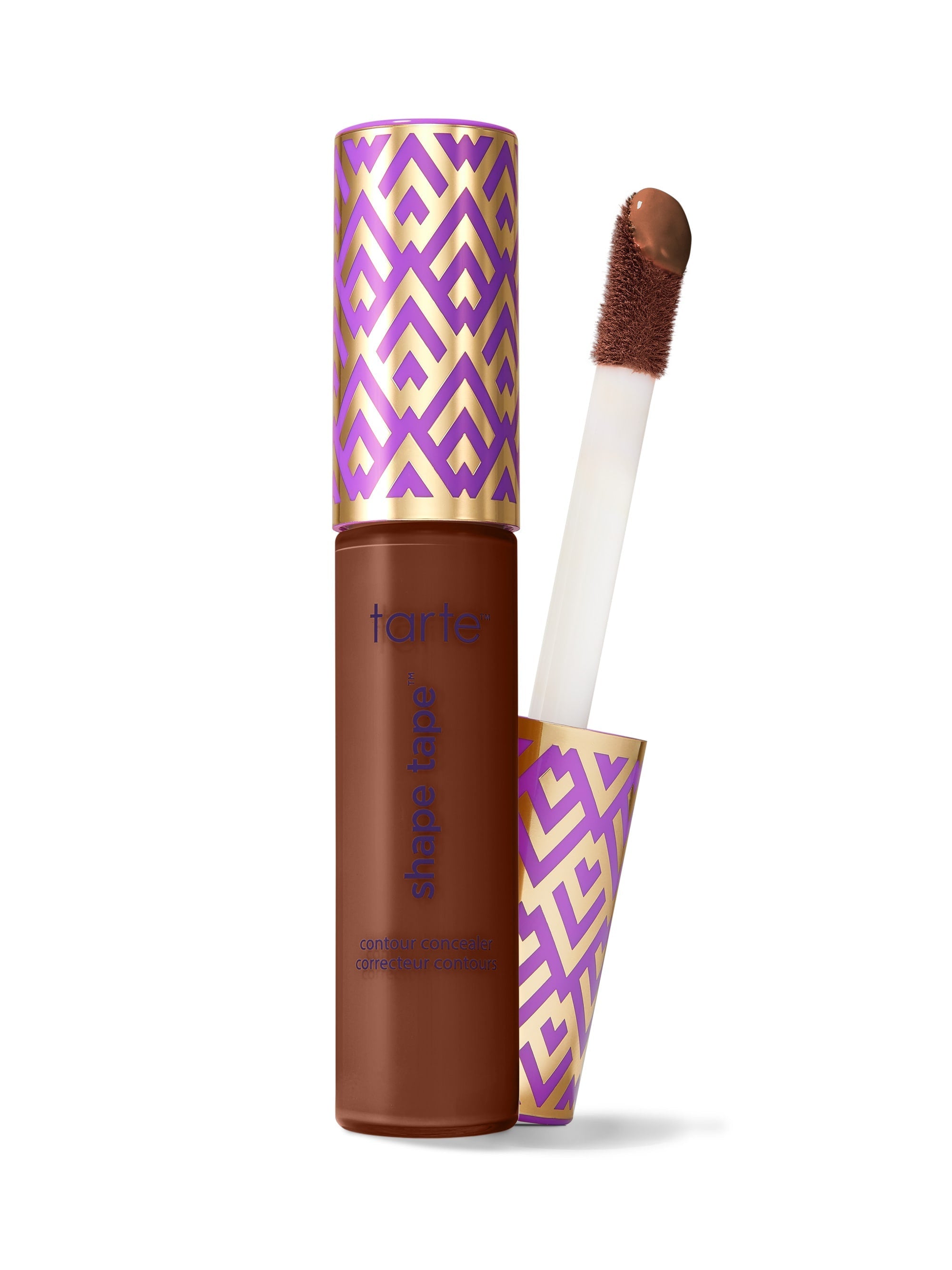 Mascara with purple and gold patterned casing and brush on a white background