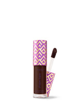 Tarte Shape Tape product with purple and white geometric pattern on a white background