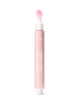 Pink face mask tube with applicator on a white background