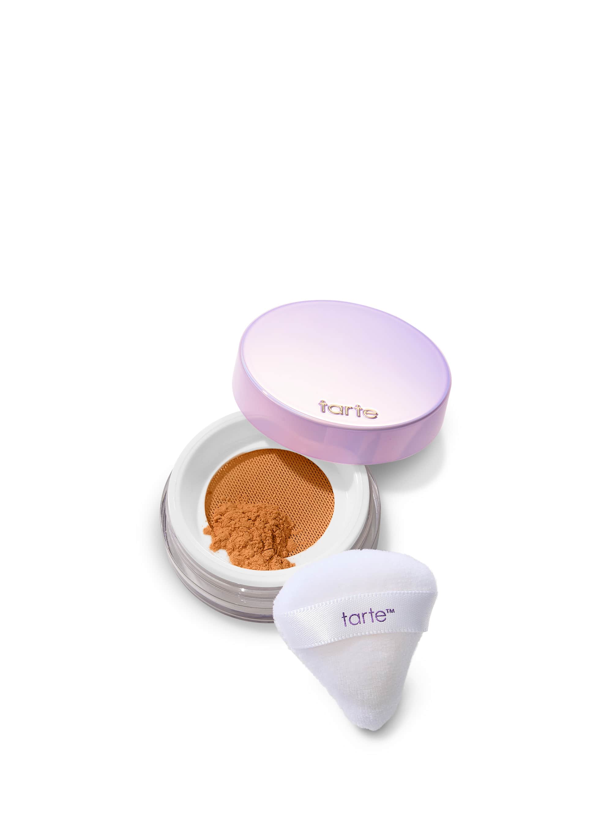 Tarte cosmetic compact with powder and applicator on a white background