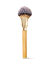 Makeup brush with wooden handle and gold ferrule on a white background