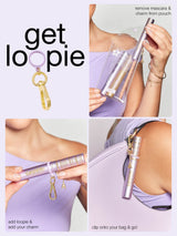 Mascara with charm and packaging instructions on a white background