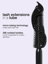 Black hairbrush with text about lash extensions and micro-tubing technology on a light gray background