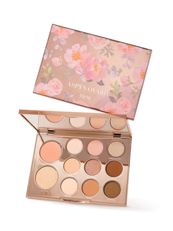 Makeup palette with floral design on the lid, featuring the brand 'Tarte'.
