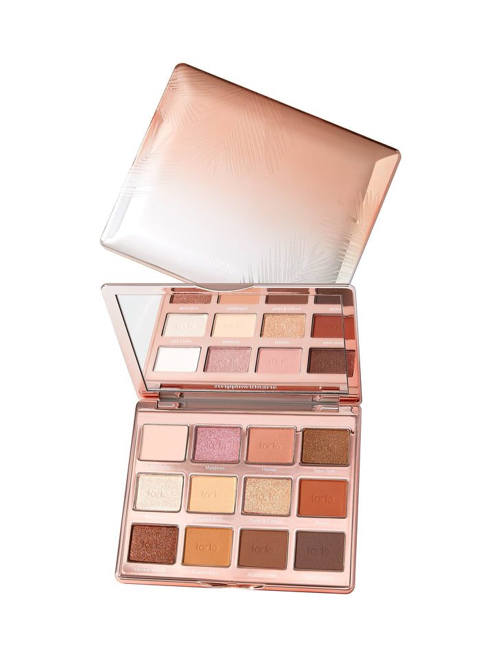 Makeup palette with various shades of eyeshadow on a white background