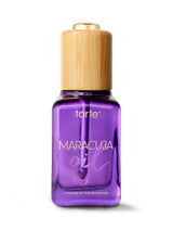 Tarte Maracuja oil bottle with wooden cap on a white background