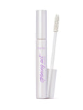 Mascara with white casing and brush on a white background