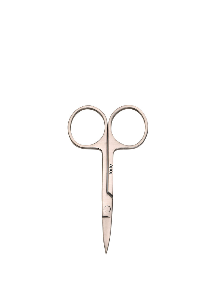 Pair of rose gold nail scissors on a white background