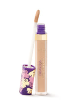 Concealer bottle with applicator on a white background