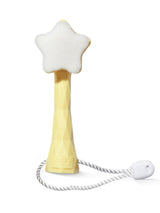 Star-shaped bath toy with a white base and gold handle on a white background