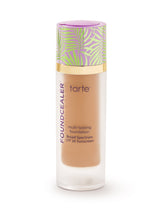 Tarte foundation bottle with leaf-patterned cap on a white background
