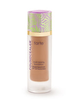 Tarte foundation bottle with colorful cap on a white background