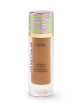 Tarte multi-tasking foundation bottle with colorful cap on a white background