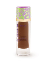 Foundation bottle with a colorful cap on a white background