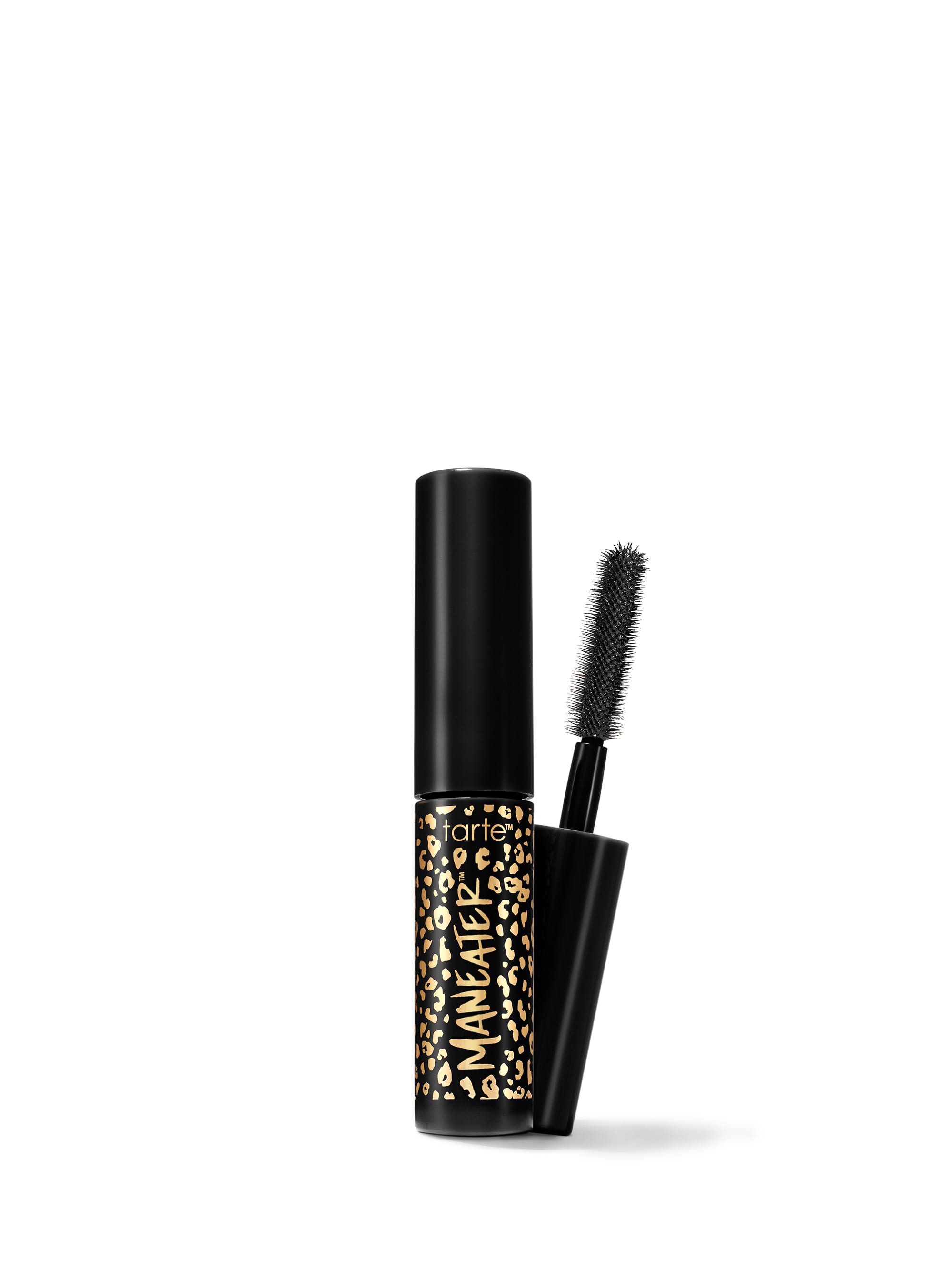 A travel-size mascara with a black tube and a brush applicator, featuring a gold and black pattern on the tube.